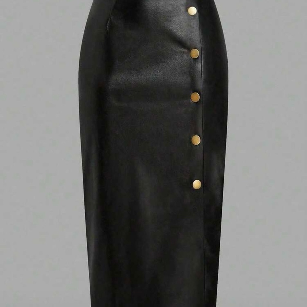 Pleather skirt with gold buttons. Never worn. Snaps down front.